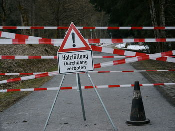 Cordon tapes with sign board on road