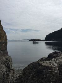 Scenic view of sea against cloudy sky