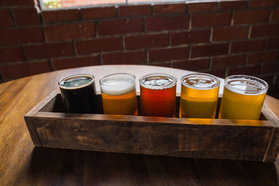 View of drinking glasses in row placed on table