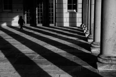 Shadow of woman walking on steps