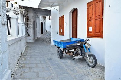 Bicycles on street amidst buildings in city