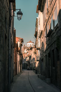 Narrow alley amidst buildings in town