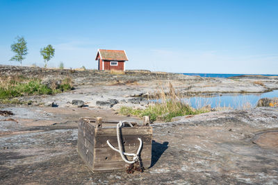 Abandoned built structure on beach against sky