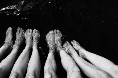 Low section of human feet in the water