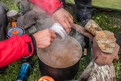 Cropped image of man preparing food