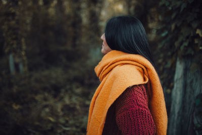 Rear view of woman in forest