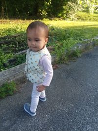 Portrait of cute girl standing outdoors