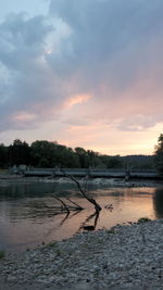 Scenic view of lake at sunset