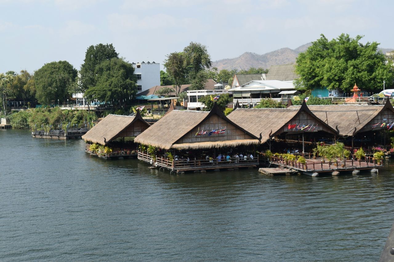 tree, water, building exterior, built structure, architecture, house, waterfront, mountain, sky, lake, river, town, nautical vessel, nature, tranquil scene, tranquility, transportation, day, scenics, residential structure