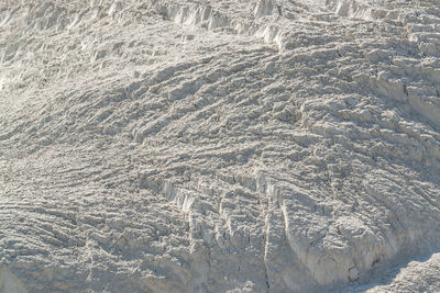 Full frame shot of frozen water on land