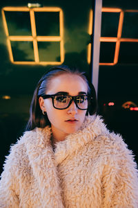 Portrait of woman with eyeglasses at home