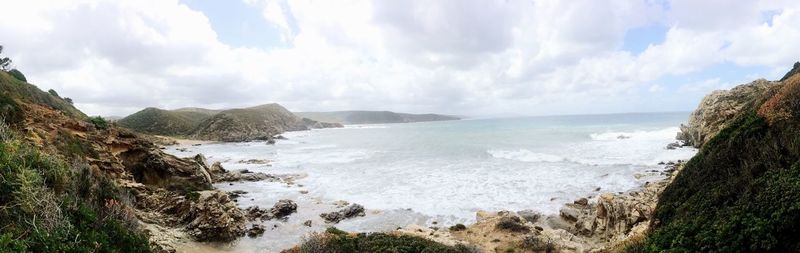 Scenic view of sea against cloudy sky
