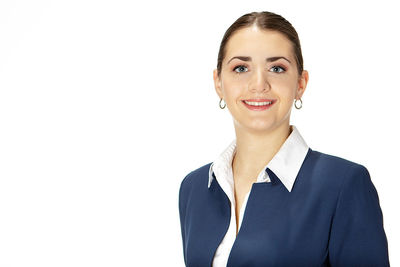 Portrait of a smiling young woman over white background