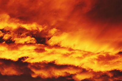 Low angle view of cloudy sky at sunset