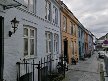 Houses against sky in city