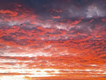 Low angle view of dramatic sky during sunset