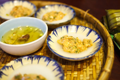 High angle view of fresh banh beo served in wicker tray