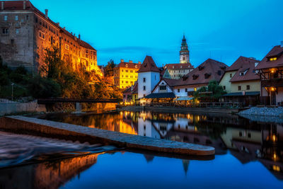 Cesky krumlov castle and the town taken at night on the vltava river. cesky kurmlov, czech republic.