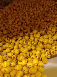 High angle view of yellow toys for sale