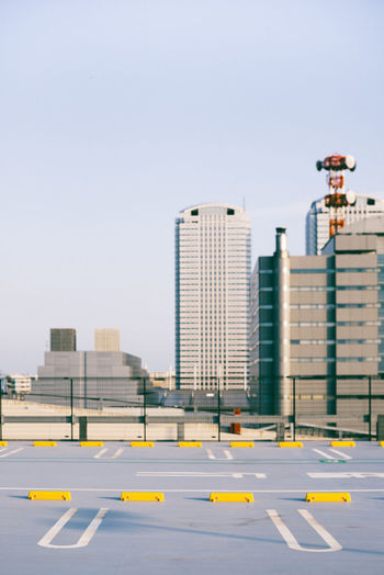 MODERN BUILDINGS AGAINST CLEAR SKY