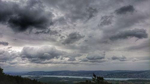 Scenic view of landscape against cloudy sky