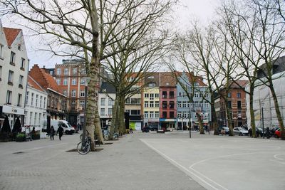 Street by buildings in city