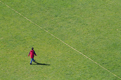 Woman standing on grass