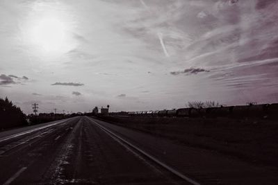 Road against sky seen through windshield