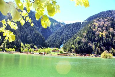 Scenic view of lake with mountains in background