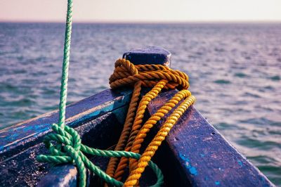 Close-up of rope tied on boat in sea