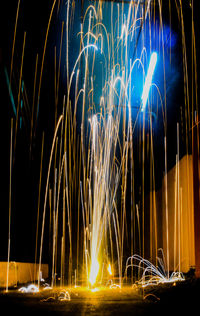 Light trails against sky at night