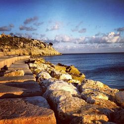 Scenic view of sea against cloudy sky