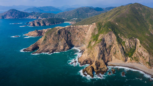 Panoramic view of rock formation in sea against sky