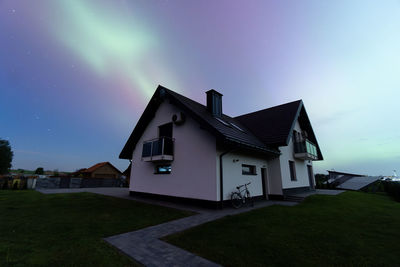 Built structures against sky at night