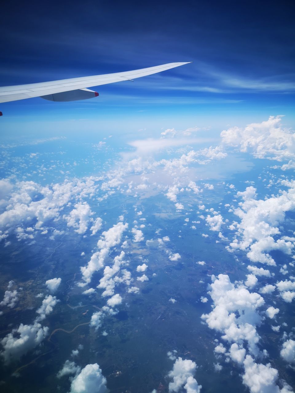 AERIAL VIEW OF AIRPLANE FLYING IN SKY