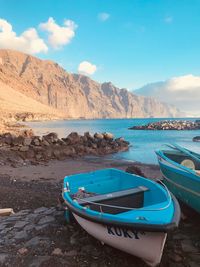 Boat moored on beach