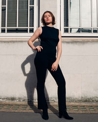 Full length of young woman posing in the city  street