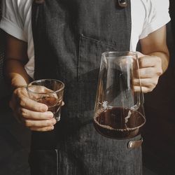 Close-up of man holding wine glass