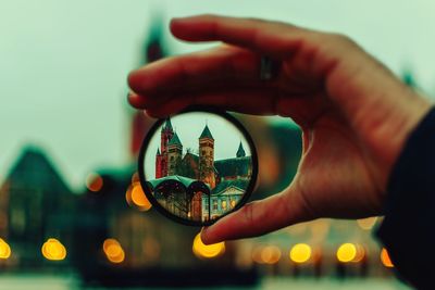 Cropped image of hand holding crystal ball