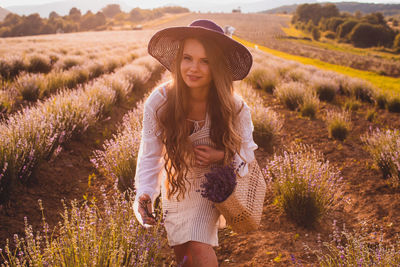 Young woman wearing hat on field