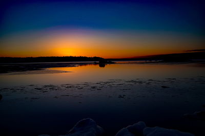 Scenic view of beach against sky during sunset
