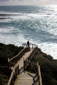 High angle view of boardwalk against sea