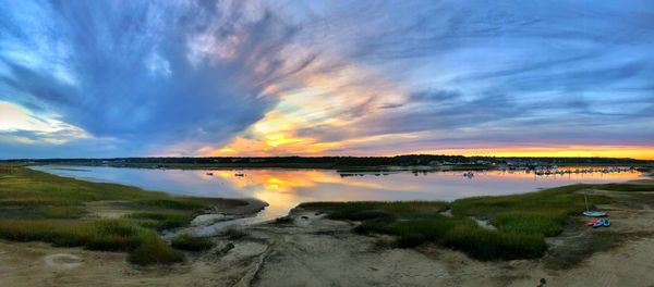 Scenic view of beach against sky during sunset
