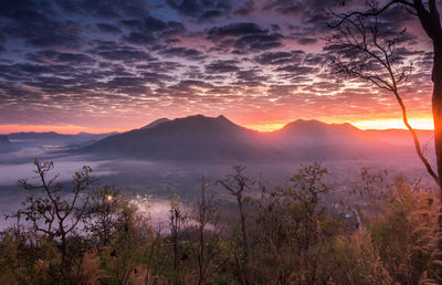 Scenic view of mountains against sky during sunset