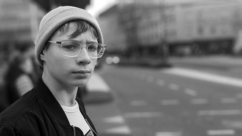 Portrait of young man on city street