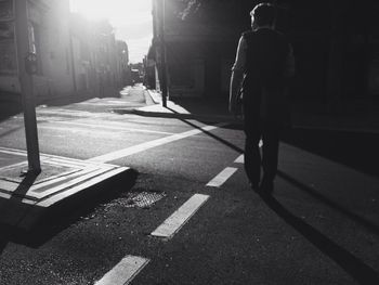 Woman walking on road