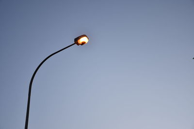 Low angle view of street light against clear sky