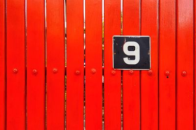 Close-up of text on red door