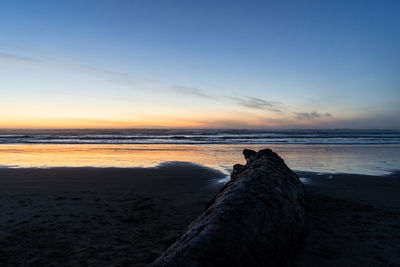 Scenic view of sea against sky during sunset