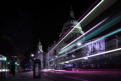 St paul's cathedral at night with light streaks illuminating the foreground.